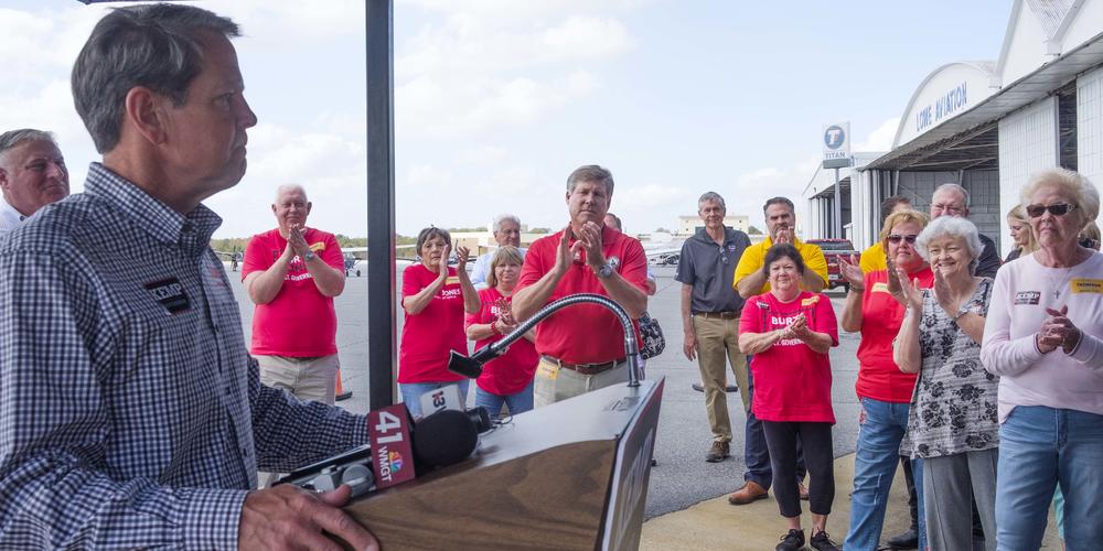 Georgia Governor Brian Kemp speaks to supporters at the Middle Georgia Regional Airport in Macon on the second stop of a last day of campaigning barnstorming tour of the state Monday.