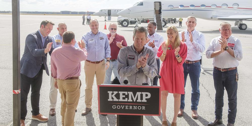 Georgia Governor Brian Kemp is backed by his wife and much of the down ballot Republican ticket during a campaign stop in Macon on the day before Election Day.