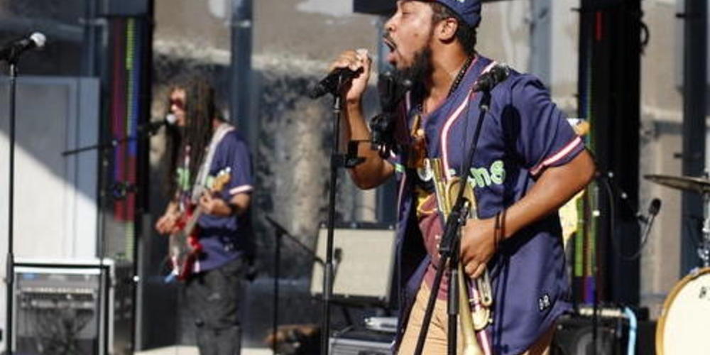 Members of the Atlanta band Biological Misfits perform OutKast's hits at the Battery outside Truist Park.
