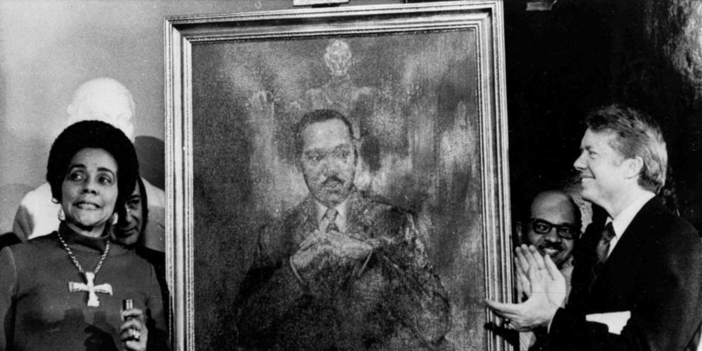 Coretta Scott King, widow of slain civil rights leader Martin Luther King Jr., speaks at an unveiling of a portrait of King by artist George Mandus, Feb. 18, 1974, and dedicated by Gov. Jimmy Carter. It is the first portrait of an African American to be represented in the state's official portrait gallery.