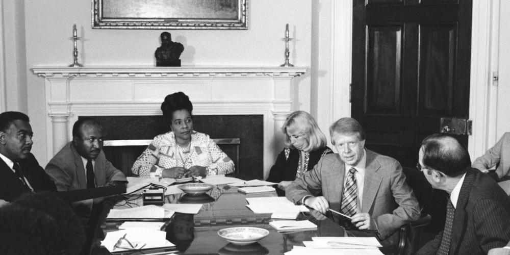 President Jimmy Carter meets with his commission for the appointment of blacks to the federal judiciary in the fifth circuit at the White House in Washington Wednesday, June 29, 1977. From left are: Horace Tate, Georgia state senator; Joe Reid; Coretta King, widow of Martin Luther King Jr.; Margaret McKenna, a staff aide; Carter; and Attorney General Griffin Bell. 
