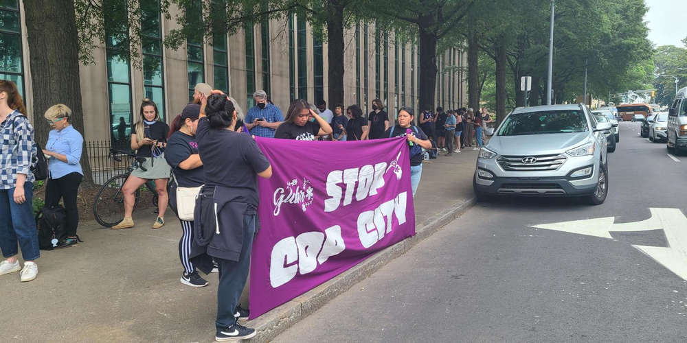 Protesters gathered, lined up and created banners in front of Atlanta City Hall on June 5, 2023 as Atlanta City Council holds a period of public comment and votes on funding for the proposed police training facility.