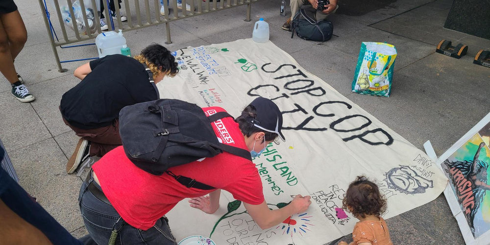 Protesters gathered, lined up and created banners in front of Atlanta City Hall on June 5, 2023 as Atlanta City Council holds a period of public comment and votes on funding for the proposed police training facility.