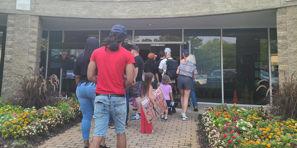 Thirty minutes after doors open for the rally the main room is filled to capacity and the line of supporters stretches outside the building.