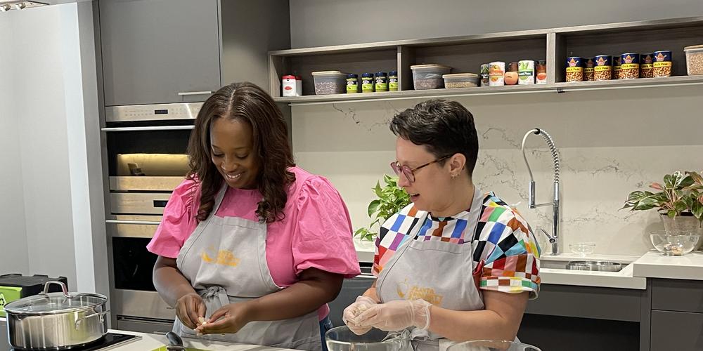 Leanna Pierre and Kristin Elliot prep ingredients for their cooking class.