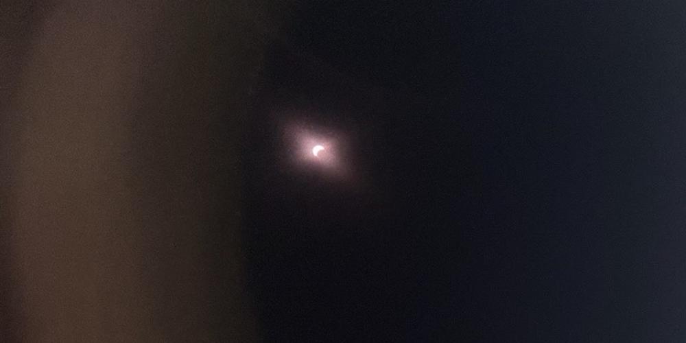 An image of the partial solar eclipse as it appeared through special solar glasses in Atlanta, Ga., on April 8, 2024.