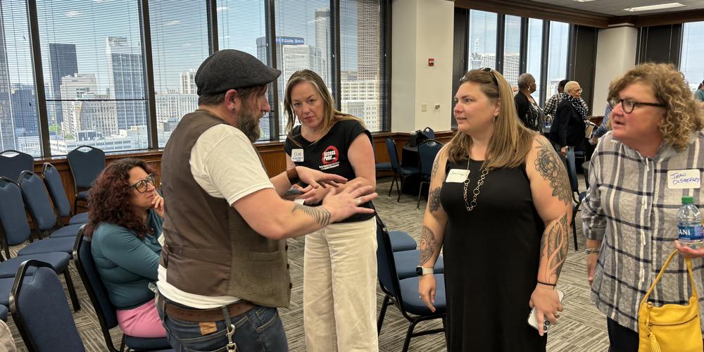 Riley Kirkpatrick (left) speaks to people
