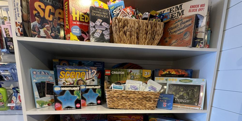 Toys and board games inside the Bloom Closet Express truck.