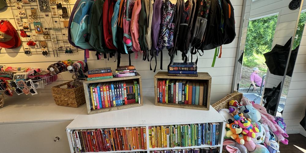 Backpacks and books inside the Bloom Closet Express truck. 