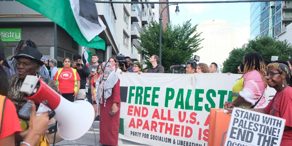 Protestors in support of Palestine rally in Midtown Atlanta on June 27, 2024.