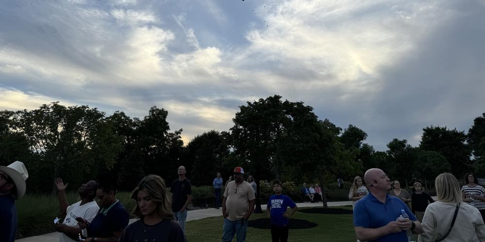 Apalachee High School students and people from the broader Barrow County community gathered for a prayer vigil in a city park after the shooting deaths of four at the school Wednesday. Chase McGee/GPB News
