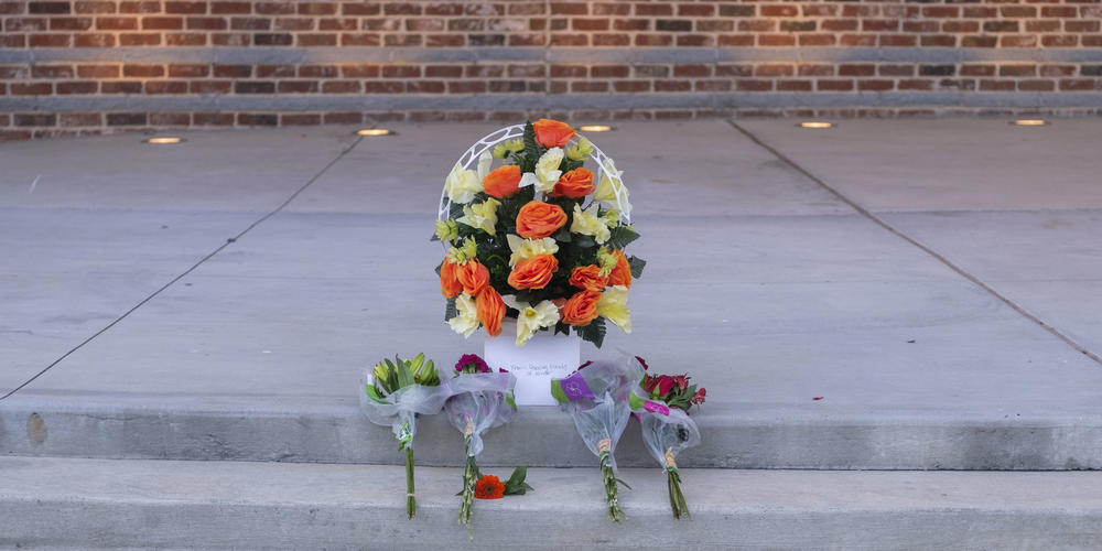 Four bouquets for the four killed at Apalachee High, at the prayer vigil honoring them Wednesday. Grant Blankenship/GPB News