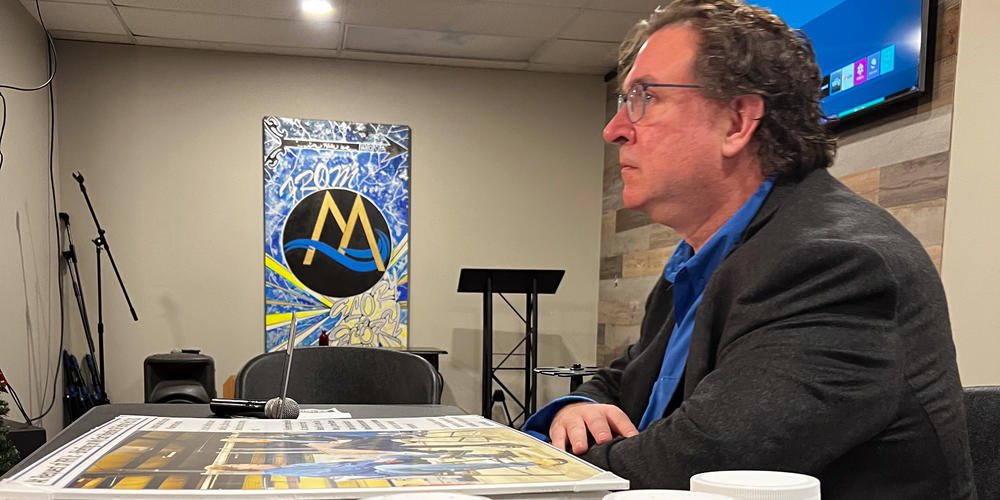Samples of soil and debris from after the BioLab fire sit in front of Scott Smith, an independent tester, as he discusses preliminary test results.