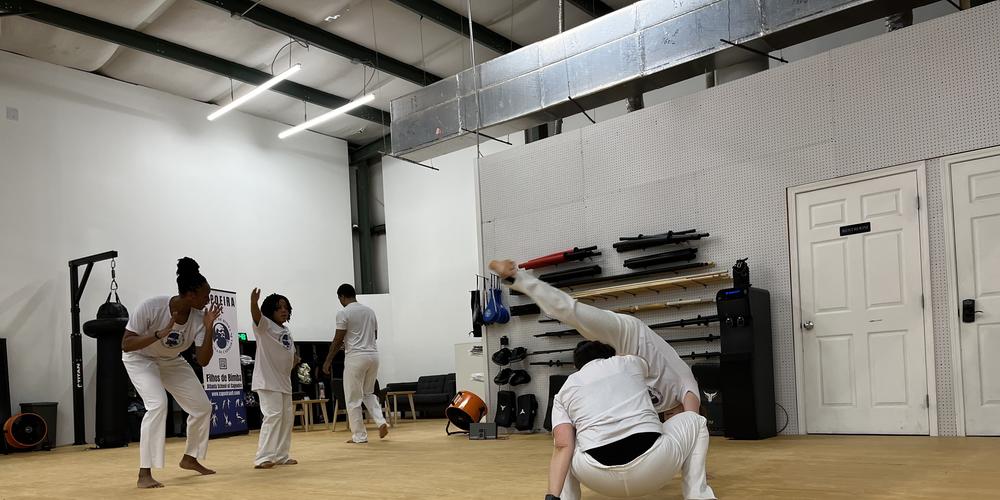 Students practice the Afro-Brazilian martial art of capoeira at Filhos de Bimba, a capoeira school in Atlanta.