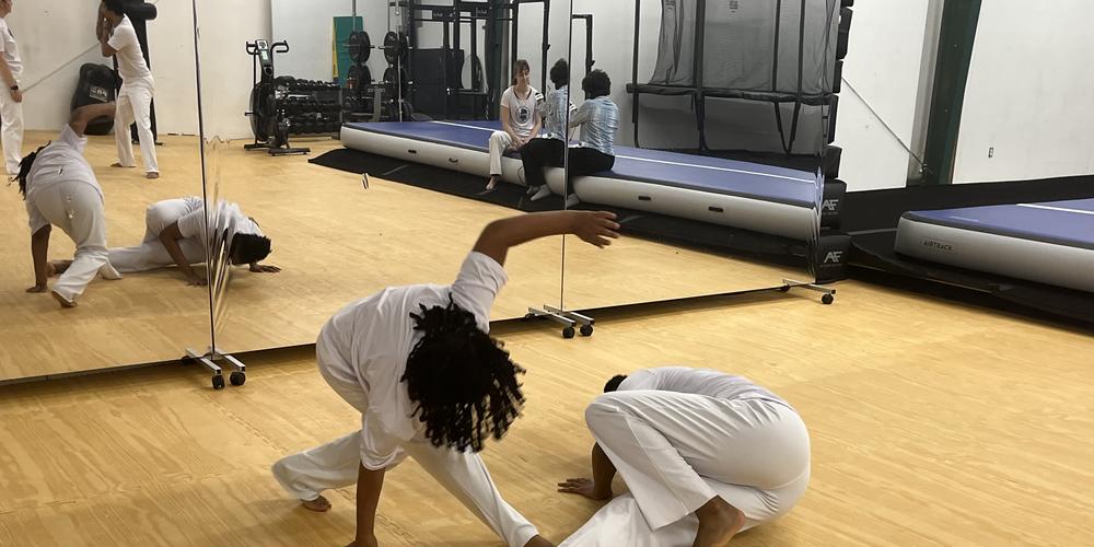 Students practice the Afro-Brazilian martial art of capoeira at Filhos de Bimba, a capoeira school in Atlanta.