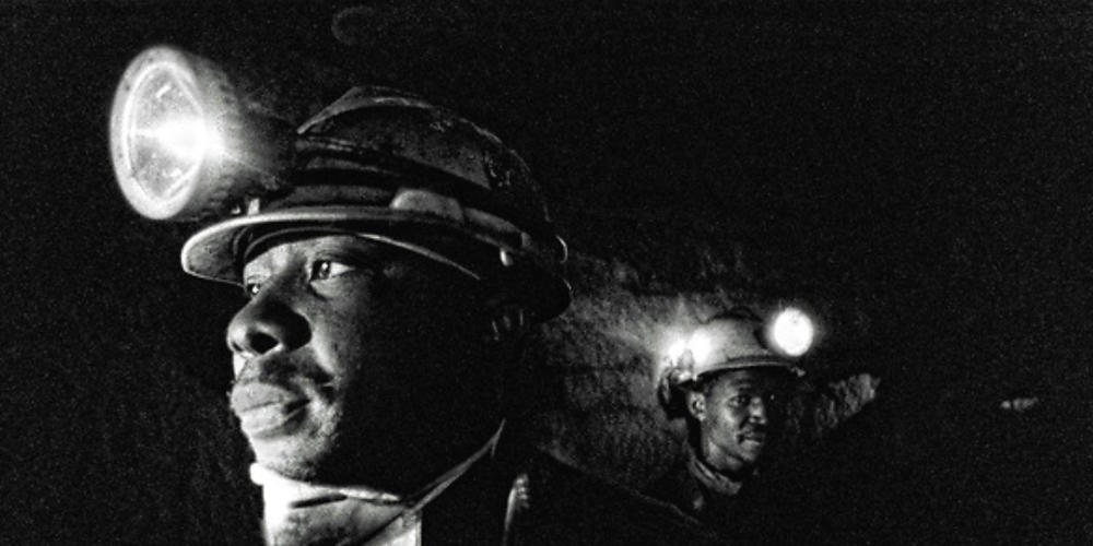Workers with headlamps. Photography by Billy Howard