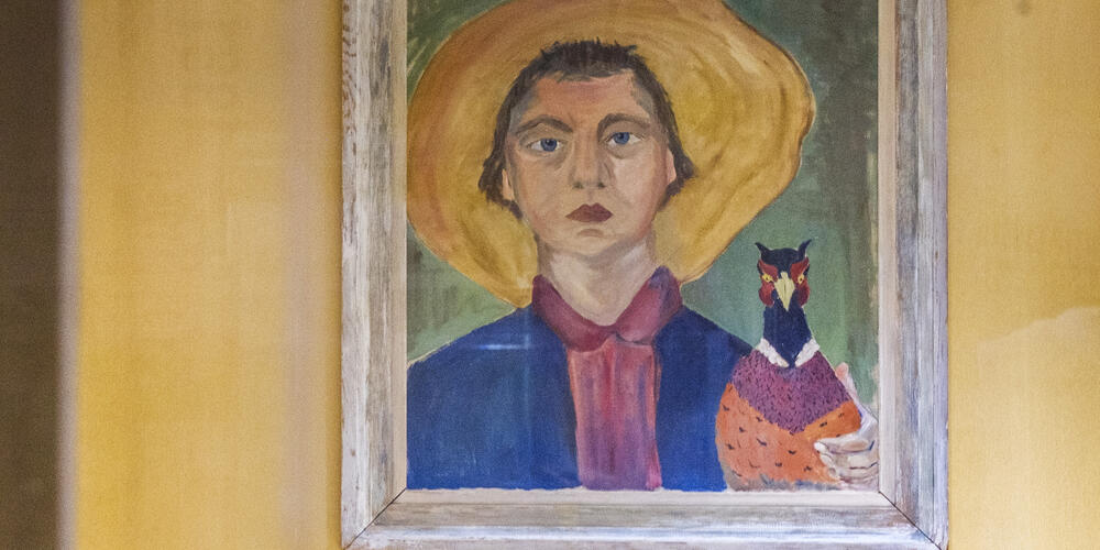 Flannery O’Connor’s portrait of herself with a pheasant, on display with many other paintings by the author often touted as the finest writer of the Southern Gothic, on the grounds of the farm in Milledgeville where she spent her adult life.