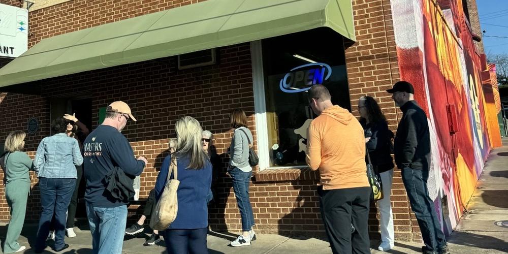 A crowd forms just after the Macon soul food restaurant, H&H, opens its doors the morning after the concert tribute to Dickey Betts .