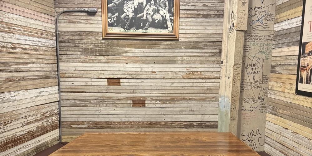 The booth where the Allman brothers convened is now a hallowed space within Grant's Lounge on Poplar Street in downtown Macon..
