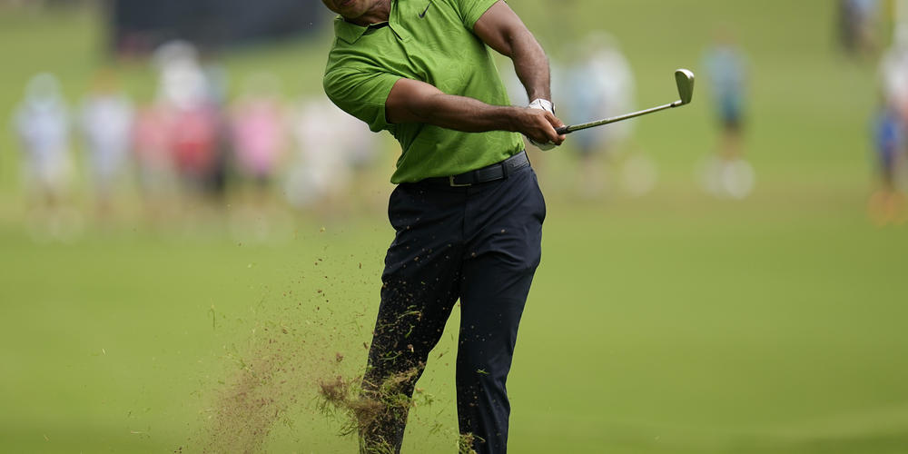 Tiger Woods hits from the rough on the second hole during the second round of the PGA Championship at Southern Hills Country Club on Friday in Tulsa, Okla.