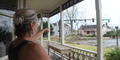 Coweta County resident surveys damage left from overnight storm in Newnan, Ga. on Friday, March 26.