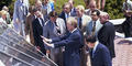Jimmy Carter speaks to media on the roof of the White House near solar panels.
