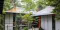 The home has a sunken courtyard in the front.