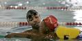 In this Sept. 25, 2007, file photo Olympic swimmer Cullen Jones, left, teaches water safety to Jaquil Wise, 7, at the pool in Newark, N.J., where Jones learned to swim. Jones won a gold medal at the Olympics on the U.S. men's 400 meter relay team at the Beijing Olympics Monday, Aug. 11, 2008.