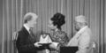 President Jimmy Carter, left, presents the Medal of Freedom Award to Coretta King, wife of the late Martin Luther King Jr., during a ceremony at the White House in Washington on Monday, July 13, 1977. Referring to the late Dr. King, the inscription on the award states that King "was the conscience of his generation." At right is Martin Luther King, Sr., father of the slain civil rights leader.