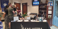 Supporters stand in the lobby by a sign-in table to hear remarks from SAG-AFTRA President Fran Drescher, who joined the Atlanta rally via Zoom.