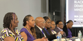Panelists at the Black Dementia Minds discussion talk about living with neurocognitive disorders. Terry Montgomery sits in the center of the panel. 