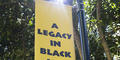 A sign reads, "A Legacy in Black and White."