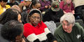 Leslie Lambert (far right) with the Rockdale Soil and Water Conservation District speaks with Walter Bannister (far left). 