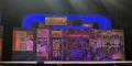The set for the play recreates a New York City street and several storefronts.