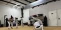 Students practice the Afro-Brazilian martial art of capoeira at Filhos de Bimba, a capoeira school in Atlanta.