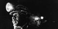 Workers with headlamps. Photography by Billy Howard