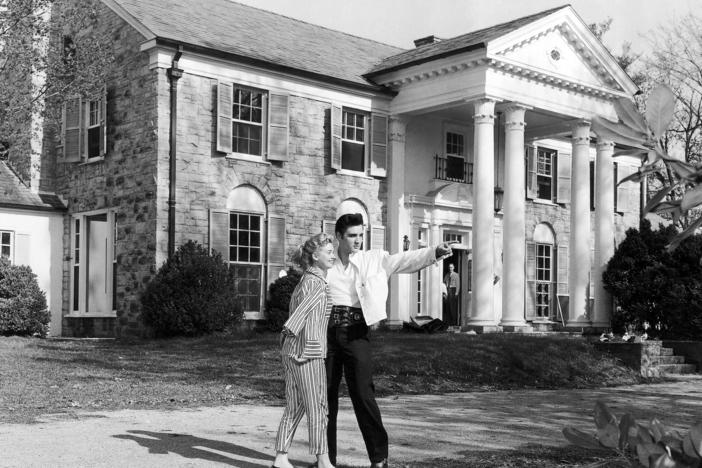 Elvis Presley pictured with then-girlfriend Yvonne Lime at his home Graceland in Memphis, Tennessee around 1957.